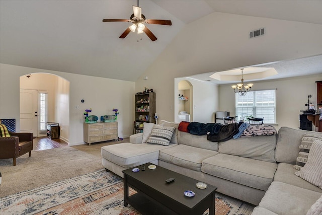 carpeted living room with ceiling fan with notable chandelier, lofted ceiling, and washer / clothes dryer