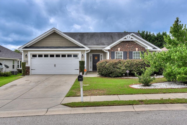 view of front of property featuring a garage and a front lawn