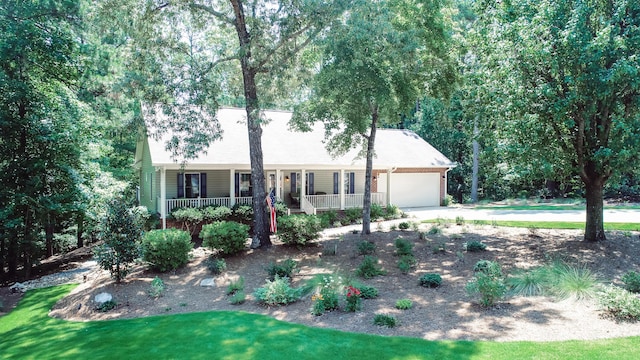 view of front of house featuring covered porch and a garage