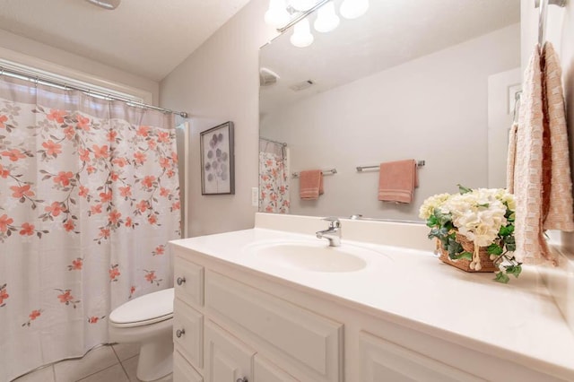 full bathroom with visible vents, toilet, a shower with shower curtain, tile patterned floors, and vanity