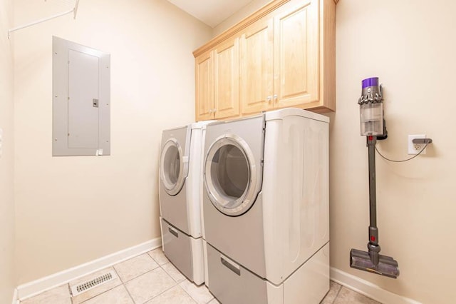laundry room featuring electric panel, visible vents, cabinet space, and washing machine and clothes dryer