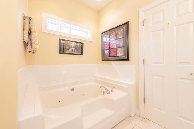 full bathroom featuring tile patterned flooring and a jetted tub