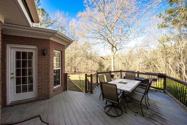 deck featuring outdoor dining area