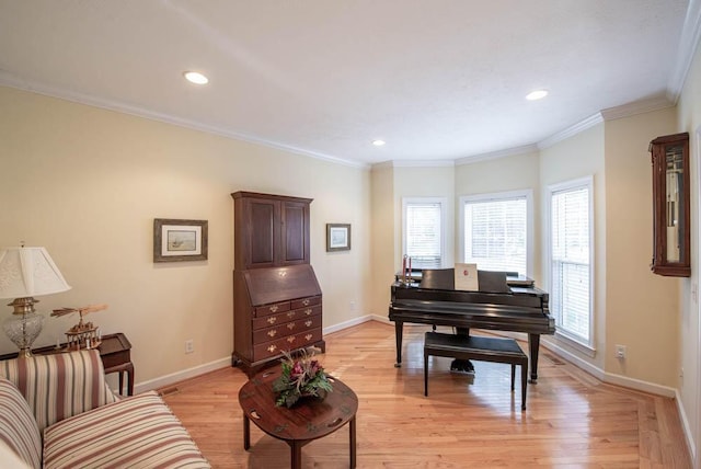 sitting room featuring recessed lighting, light wood-type flooring, baseboards, and ornamental molding