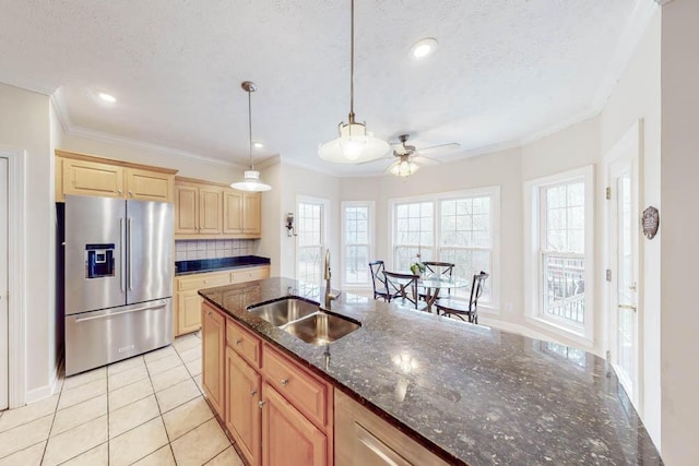 kitchen featuring light tile patterned floors, stainless steel fridge with ice dispenser, ceiling fan, a sink, and backsplash