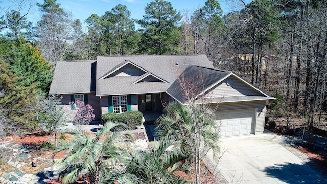 527 Scarlett Way, Mccormick, SC 29835 - view of front of home with a shingled roof, driveway, a view of trees, and an attached garage