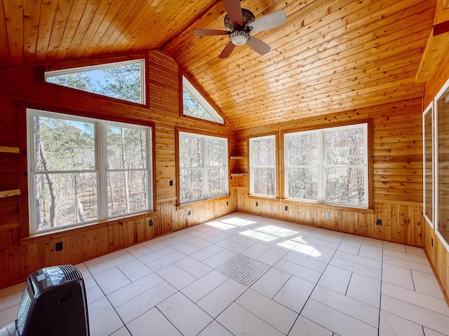 unfurnished sunroom with lofted ceiling, ceiling fan, and wood ceiling