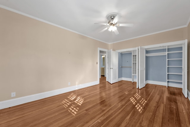 207 W Liberty St, Washington, GA 30673 - unfurnished bedroom featuring crown molding, baseboards, ceiling fan, and wood finished floors
