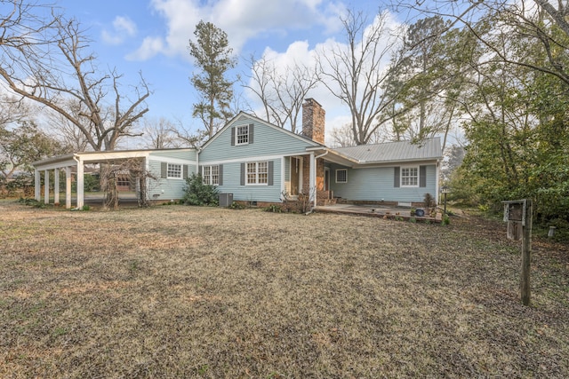 207 W Liberty St, Washington, GA 30673 - view of front facade featuring crawl space, metal roof, a chimney, and a front lawn