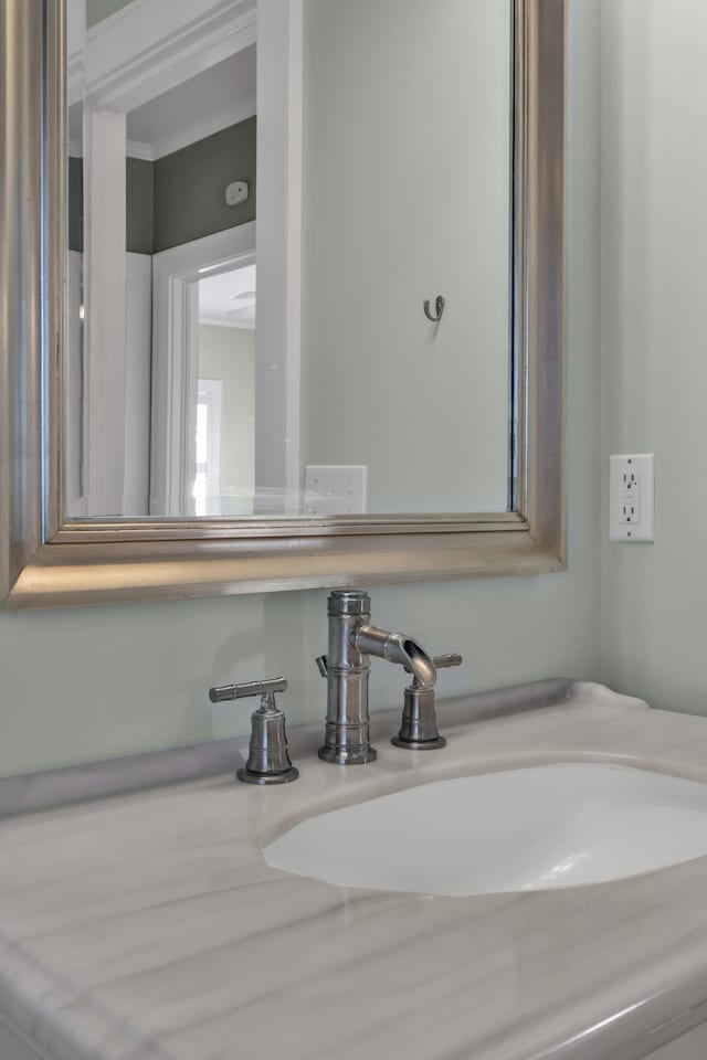207 W Liberty St, Washington, GA 30673 - bathroom featuring ornamental molding and a sink