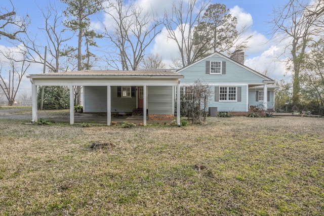 207 W Liberty St, Washington, GA 30673 - view of front of house with a front yard, metal roof, a chimney, and central air condition unit