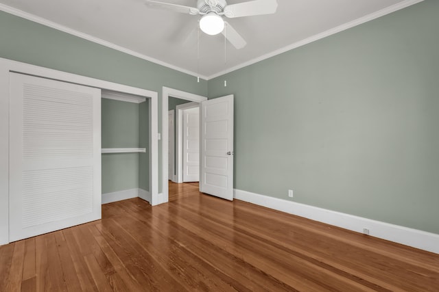 207 W Liberty St, Washington, GA 30673 - unfurnished bedroom with ornamental molding, a closet, wood finished floors, and baseboards