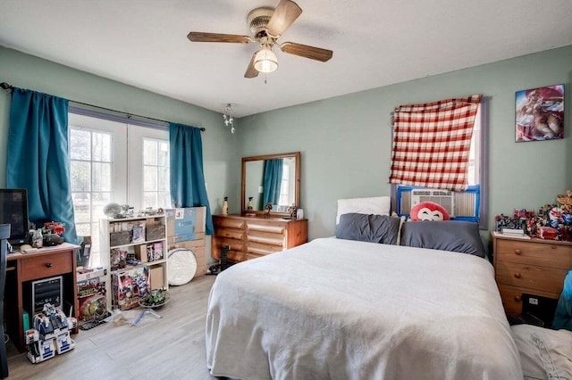 7419 Fullbright Rd, Appling, GA 30802 - bedroom featuring cooling unit, ceiling fan, and wood finished floors