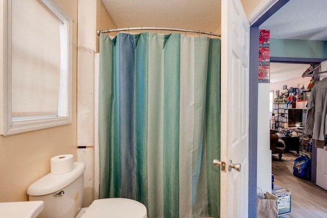 7419 Fullbright Rd, Appling, GA 30802 - bathroom featuring wood finished floors and a shower with shower curtain