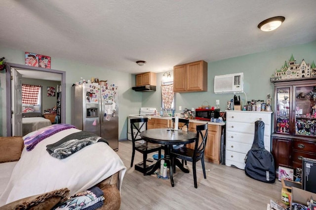 7419 Fullbright Rd, Appling, GA 30802 - bedroom with stainless steel fridge, light wood finished floors, and a textured ceiling