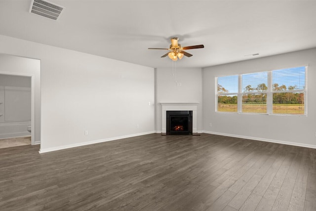 1254 Birch Cir, Grovetown, GA 30813 - unfurnished living room with ceiling fan, a fireplace with flush hearth, and dark wood-style floors