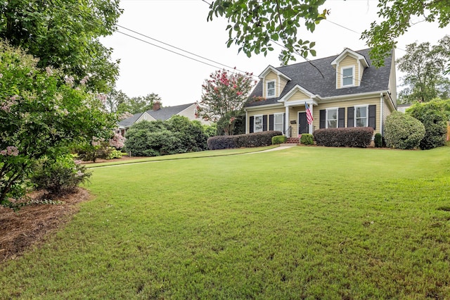 707 Hickman Rd, Augusta, GA 30904 - cape cod house featuring a front yard and roof with shingles