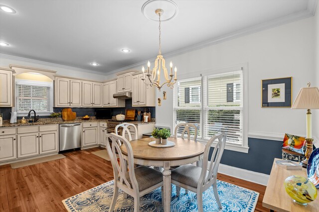 707 Hickman Rd, Augusta, GA 30904 - dining room featuring a chandelier, plenty of natural light, light wood finished floors, crown molding, and recessed lighting