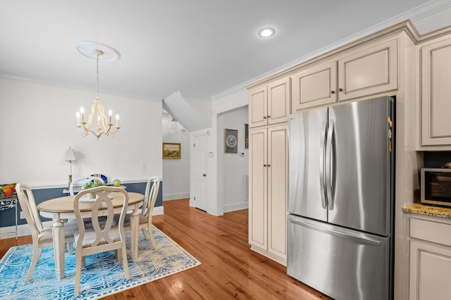 707 Hickman Rd, Augusta, GA 30904 - dining area with light wood-type flooring, a chandelier, ornamental molding, and recessed lighting
