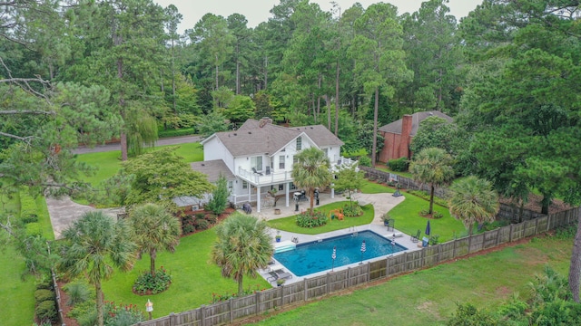 view of swimming pool with a fenced in pool, a lawn, a patio, and a fenced backyard