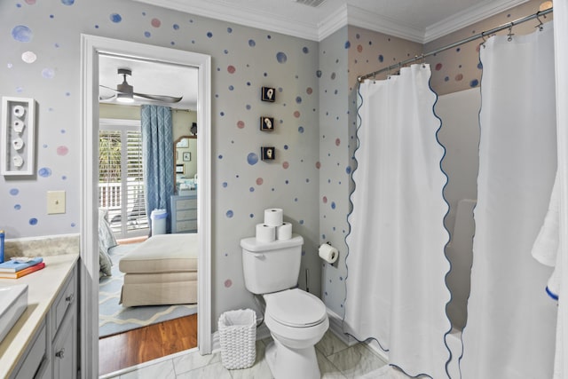 full bathroom featuring ornamental molding, ceiling fan, toilet, ensuite bathroom, and vanity