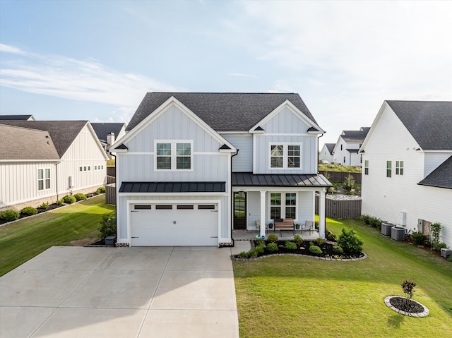 3067 Rosewood Dr, Evans, GA 30809 - modern inspired farmhouse with covered porch, board and batten siding, a shingled roof, a standing seam roof, and concrete driveway