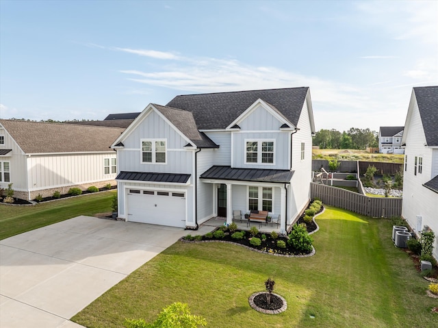 3067 Rosewood Dr, Evans, GA 30809 - modern farmhouse with a standing seam roof, an attached garage, concrete driveway, board and batten siding, and a shingled roof