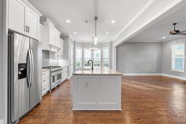 3067 Rosewood Dr, Evans, GA 30809 - kitchen featuring appliances with stainless steel finishes, crown molding, white cabinetry, dark wood-style floors, and a chandelier