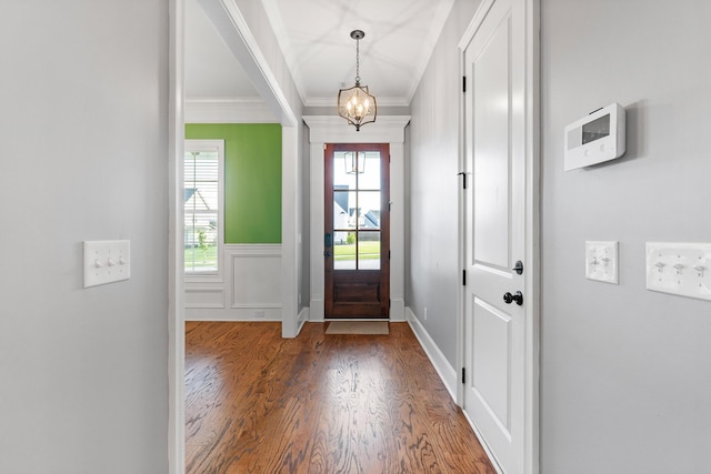 3067 Rosewood Dr, Evans, GA 30809 - entrance foyer with wood finished floors, crown molding, a chandelier, and a wainscoted wall