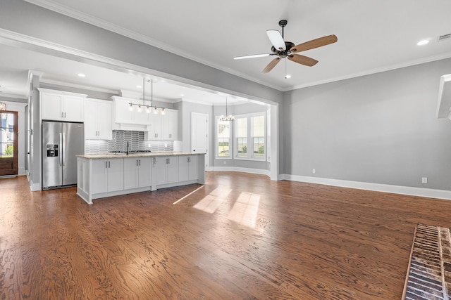 3067 Rosewood Dr, Evans, GA 30809 - kitchen featuring stainless steel fridge, plenty of natural light, dark wood-style floors, crown molding, and recessed lighting