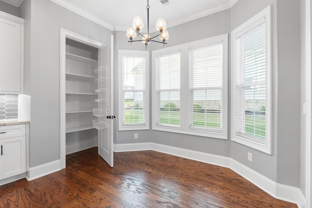 3067 Rosewood Dr, Evans, GA 30809 - unfurnished dining area featuring dark wood-style floors, crown molding, and a chandelier