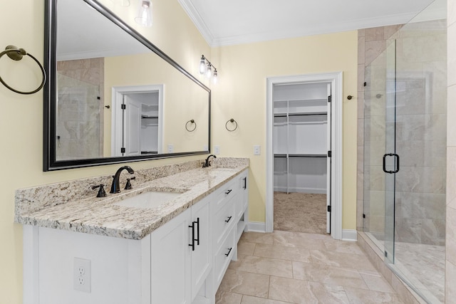 3067 Rosewood Dr, Evans, GA 30809 - full bath featuring a walk in closet, double vanity, a stall shower, and crown molding