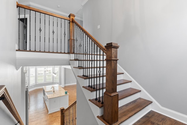3067 Rosewood Dr, Evans, GA 30809 - staircase with wood finished floors, ornamental molding, and a chandelier
