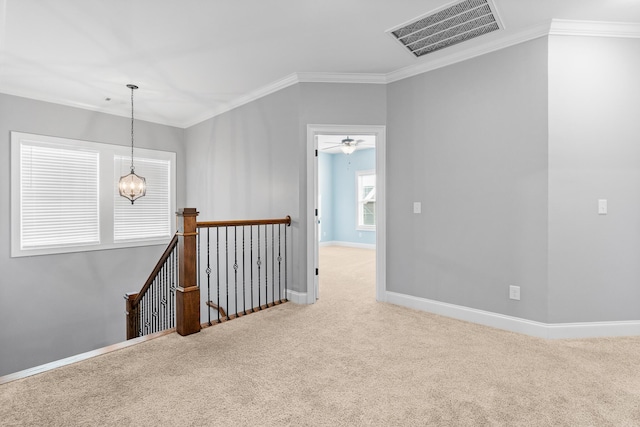 3067 Rosewood Dr, Evans, GA 30809 - unfurnished room featuring carpet flooring, ornamental molding, and a chandelier