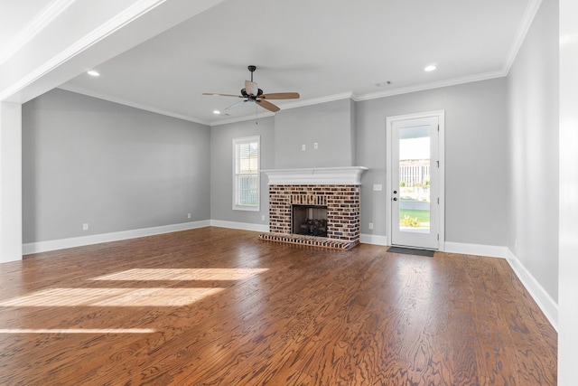 3067 Rosewood Dr, Evans, GA 30809 - unfurnished living room featuring plenty of natural light, ceiling fan, wood finished floors, recessed lighting, and a brick fireplace