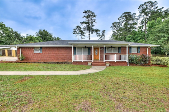 103 Adams Ln, Grovetown, GA 30813 - ranch-style house featuring a porch, brick siding, ceiling fan, and a front lawn