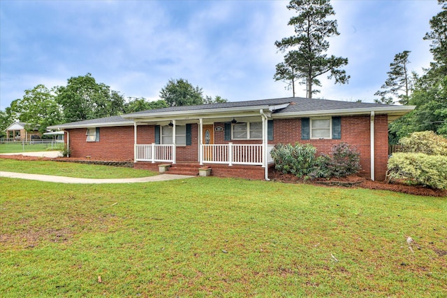 103 Adams Ln, Grovetown, GA 30813 - ranch-style house with a porch, a front yard, and brick siding