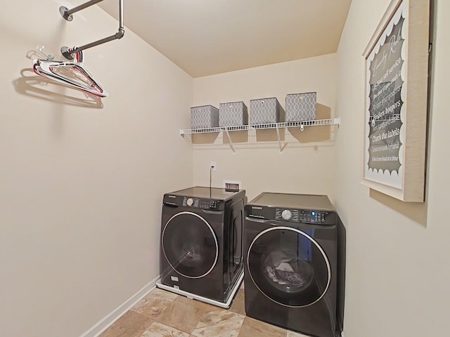 1038 Dietrich Ln, North Augusta, SC 29860 - laundry room featuring separate washer and dryer, baseboards, and stone finish floors