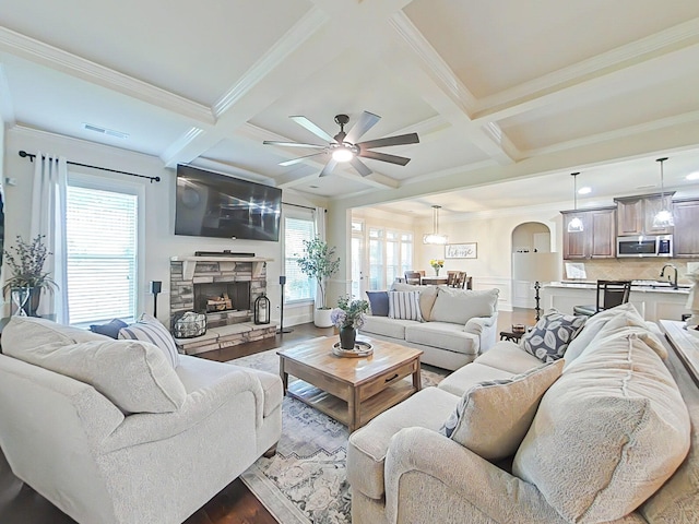 1038 Dietrich Ln, North Augusta, SC 29860 - living room with coffered ceiling, wood finished floors, arched walkways, ceiling fan, and beamed ceiling
