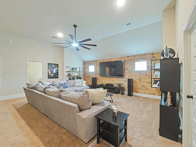 1038 Dietrich Ln, North Augusta, SC 29860 - living room with light colored carpet, wood walls, a ceiling fan, plenty of natural light, and baseboards