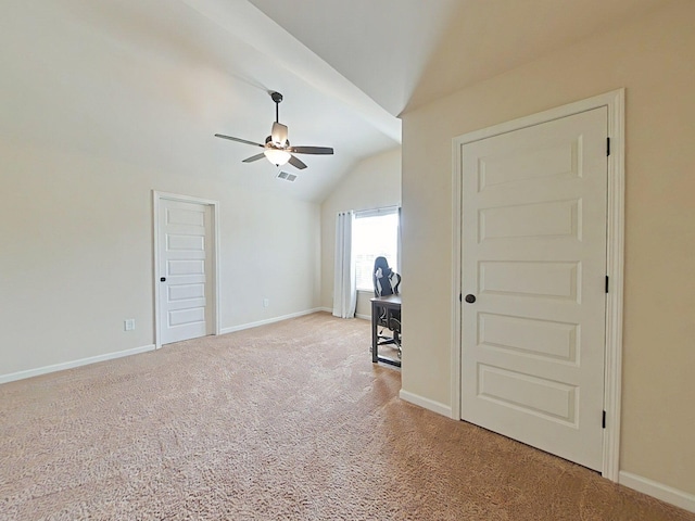 1038 Dietrich Ln, North Augusta, SC 29860 - spare room featuring vaulted ceiling, a ceiling fan, light carpet, and baseboards