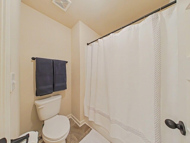 1038 Dietrich Ln, North Augusta, SC 29860 - full bathroom with toilet, baseboards, and curtained shower
