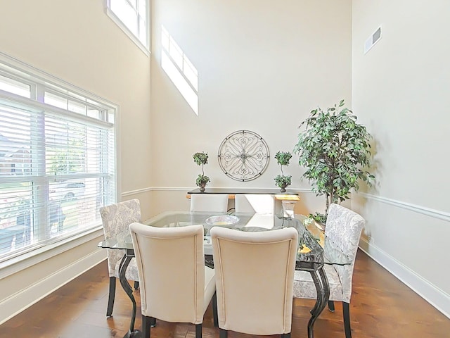 1038 Dietrich Ln, North Augusta, SC 29860 - dining space featuring plenty of natural light, baseboards, a high ceiling, and dark wood finished floors