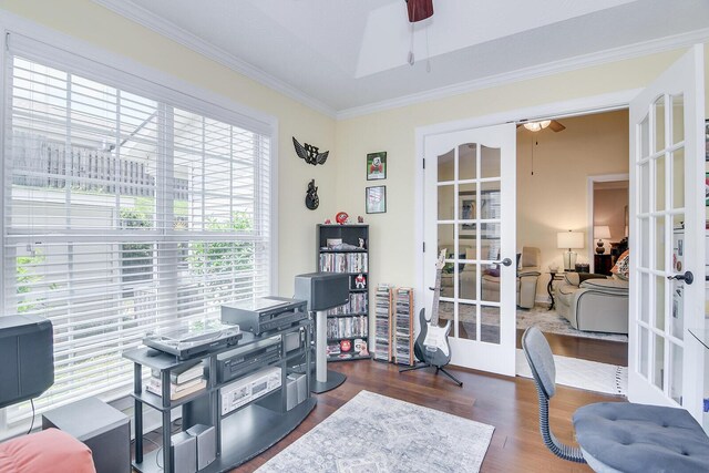 office area with french doors, a ceiling fan, crown molding, and wood finished floors
