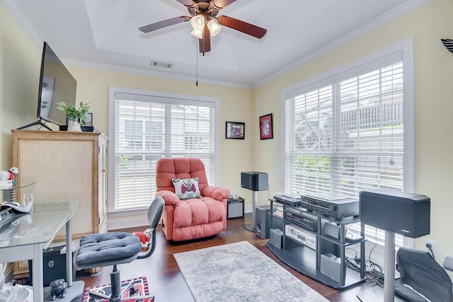 office space featuring a ceiling fan, wood finished floors, and crown molding