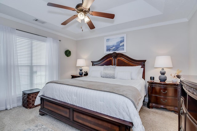 bedroom with light carpet, ornamental molding, and a ceiling fan