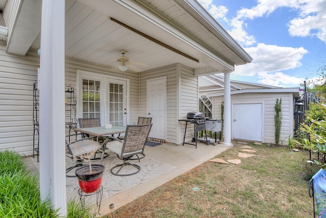 view of patio / terrace featuring a storage shed, an outdoor structure, a grill, and outdoor dining area