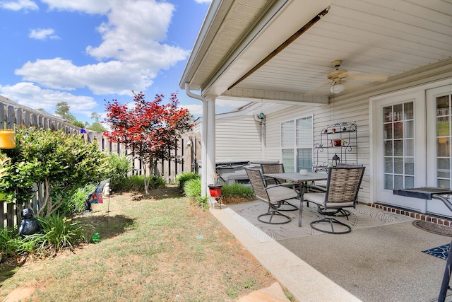 view of patio / terrace featuring a ceiling fan, a fenced backyard, and outdoor dining area