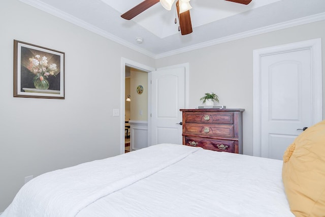 bedroom with ornamental molding and ceiling fan