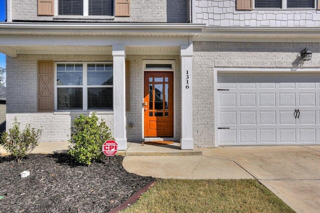 view of exterior entry featuring a garage